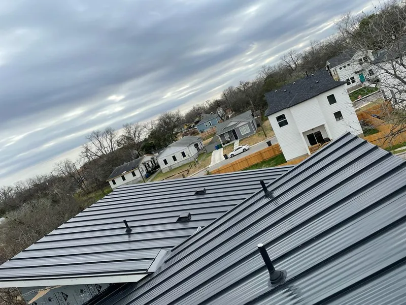 Standing seam metal roof panels with vents for Skylight Repair in Des Moines